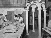 Plasterers at work in a plaster shop